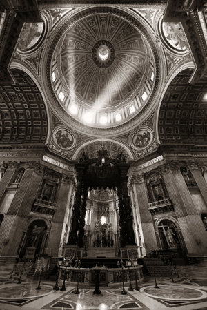 St. Peterâs Basilica interior with light beam in Vatican City.の写真素材
