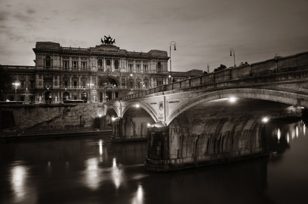 Bridge over River Tiber and Palace of Justice (Palazzo di Giustizia) at night in Rome, Italy.の写真素材