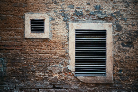 Italy Siena old building windows and brick wallの写真素材