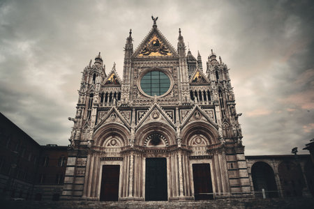 Siena Cathedral closeup as the famous landmark in medieval town in an overcast day in Italy.の写真素材