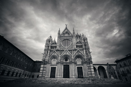 Siena Cathedral closeup as the famous landmark in medieval town in an overcast day in Italy.の写真素材