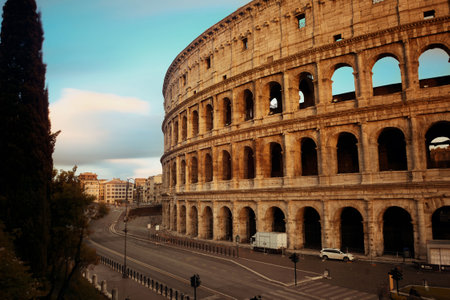 Colosseum with street view at sunset, the world known landmark and the symbol of Rome, Italy.の写真素材
