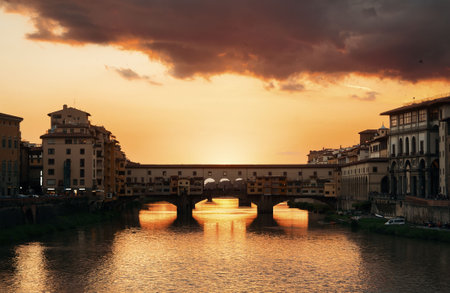 Ponte Vecchio over Arno River in Florence Italy at sunriseの写真素材