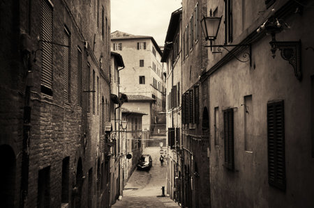 Street view with old buildings in Siena, Italy.の写真素材