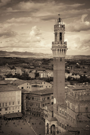 Medieval town Siena skyline view with historic buildings and Town Hall Bell Tower in Italyの写真素材