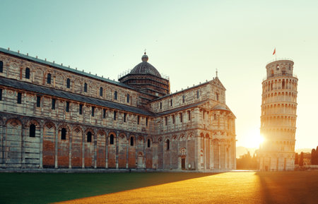Leaning tower and cathedral at sunrise in Pisa, Italy as the worldwide known landmark.の写真素材