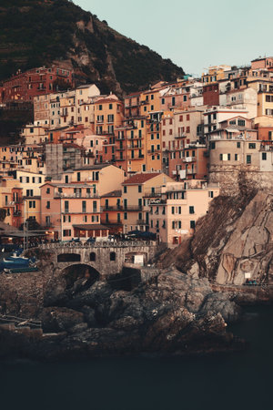 Manarola overlook Mediterranean Sea with buildings over cliff in Cinque Terre, Italy.の写真素材