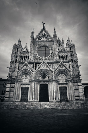 Siena Cathedral closeup as the famous landmark in medieval town in an overcast day in Italy.の写真素材