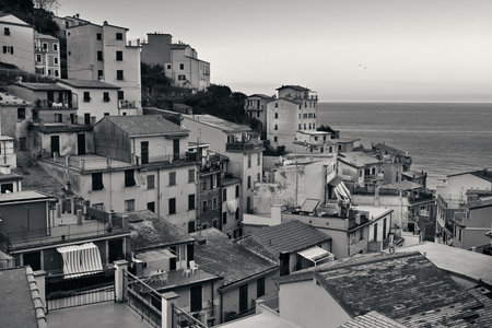 Riomaggiore waterfront view with buildings black and white in Cinque Terre, Italy.の写真素材