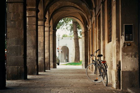 Lucca street view with bike in hallway in Italyの写真素材
