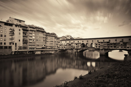 Ponte Vecchio over Arno River in Florence Italy in monochrome.の写真素材