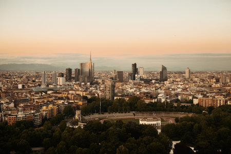 Milan city skyline with business district office building viewed from above at sunset in Italy.の写真素材