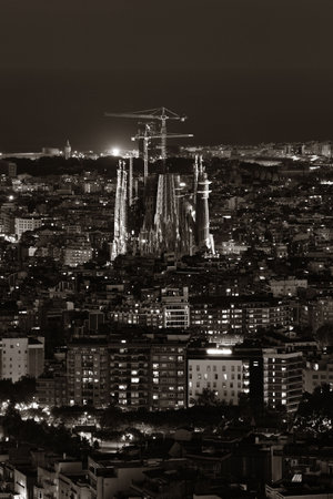 Sagrada Familia with city skyline at night in Barcelona, Spain.の写真素材