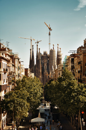Sagrada Familia in street as the famous landmark and UNESCO site in Barcelona, Spain.の写真素材