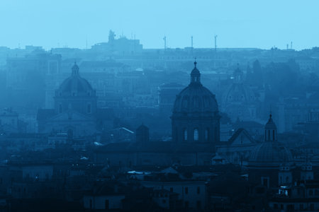 Rome rooftop view at sunrise silhouette with ancient architecture in Italy.の写真素材