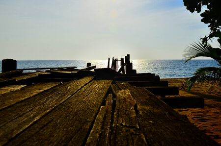 old wooden walkway  to the sea at Pilai,Phang-nga,thailandの写真素材