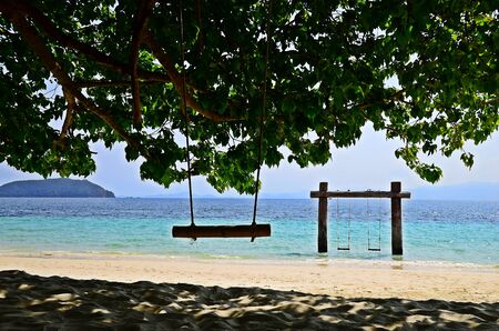 Wooden swing for traveler joy relaxing at Madambeach , Nyaung Oo phee Island , Myanmarの写真素材