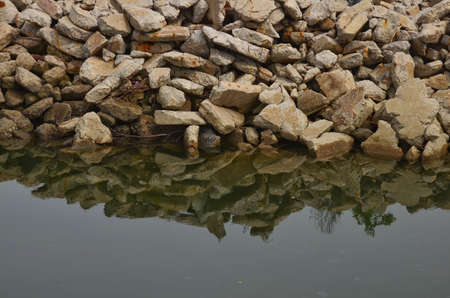 A group of rocks and reflectionsの写真素材