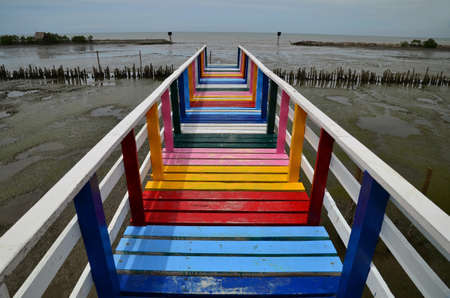 Perspective view of the beautiful colorful rainbow wooden bridge in Samut Sonkram Province, Thailandの写真素材