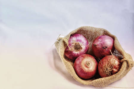 red onions in sack colth bag , vintage styleの写真素材