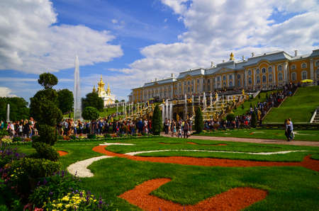 In the summer, tourists come to visit the beautiful fountain and garden at Peterhof Palace , St....