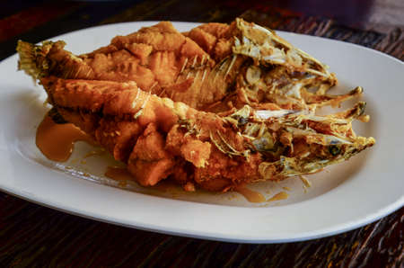 Thai food : Snapper topped with sauceの写真素材