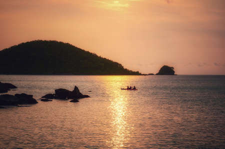 the golden light of the sun falling at Koh Mak.