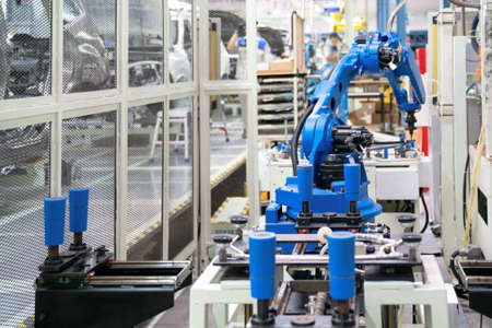 Automatic robot glass sealing in smart manufacturing factory 4.0 in the process of car...