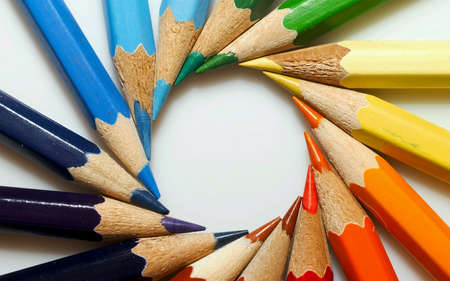 On a white backdrop, colored pencils were used to draw a circle.