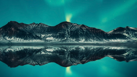 The landscape is stunning, the light hitting the water creates a beautiful reflection of the...
