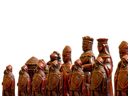 Red chess pieces pictured against a white background