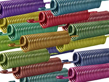 Coloured metal springs against a white background