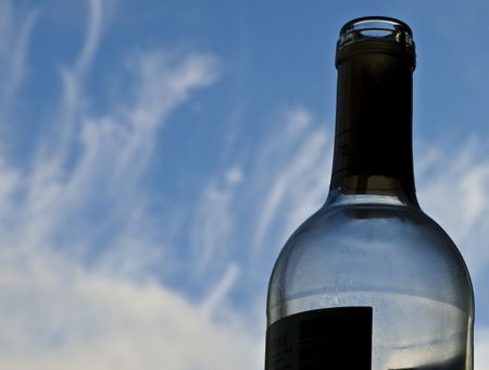 Wine bottle pictured against a summer skyの写真素材