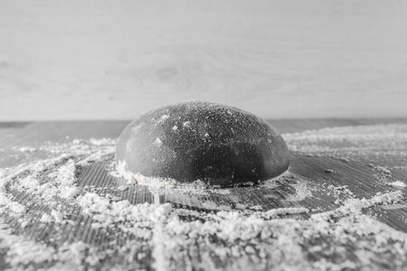 Black dough ball with flour. Cooking black pizza with italianblack dough. Food blanks in restaurant.の写真素材