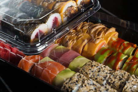 Sushi set on black background. Japanese seafoodの写真素材