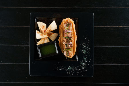Pork kebab. Barbecue tasty meat ot the black plate. Close-up.の写真素材