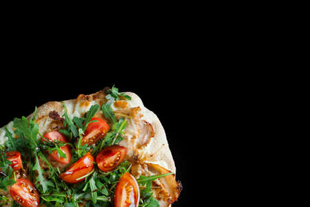 Pinsa romana gourmet italian cuisine on black background. Scrocchiarella traditional dish. Food...