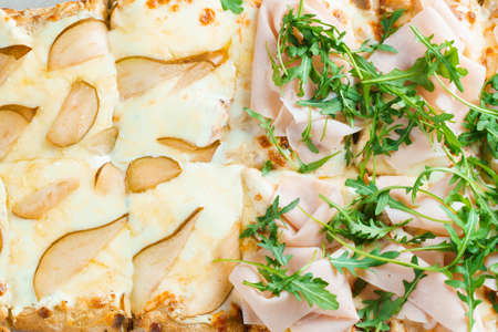 Pinsa romana with pear, cheese, prosciutto in delivery box. Scrocchiarella gourmet italian cuisine...