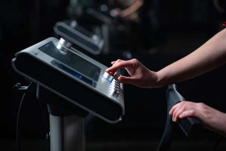 EMS device in gym. Sport training in electrical muscle stimulation suit.の写真素材