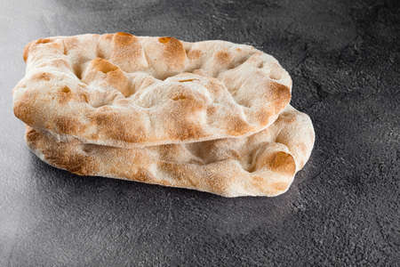 Dough for pinsa romana and scrocchiarella gourmet italian cuisine. Traditional dish in italy. Food delivery from pizzeriaの写真素材