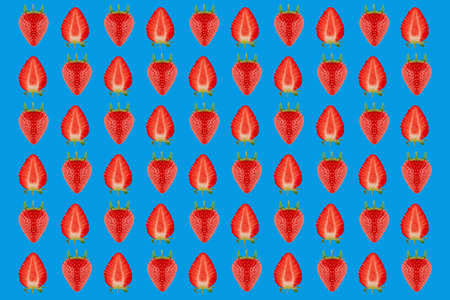 Strawberry pattern on blue background. Seasonal berry.の写真素材