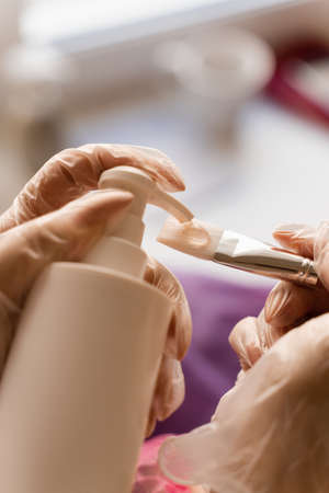 Facial gel mask on the brush. Prepearing for cosmetological procedure of moisturizing faceの写真素材