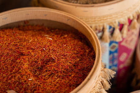 Assortment of Turkish spices and herbs in wooden bowls. Turkish market spices such as saffron, sumac and thyme. Cumin, rosemary and isotの写真素材