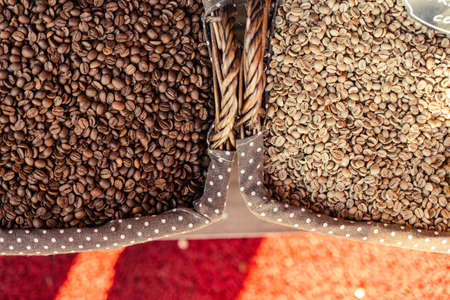 Roast coffee beans of robusta and arabica in wooden basket Turkish market. Different degrees of coffee roastingの写真素材