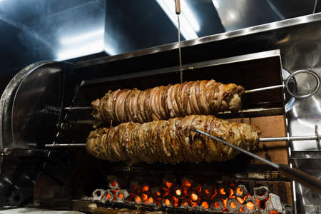 Kokorech lamb intestines roasting in Turkish market. Traditional street foodの写真素材