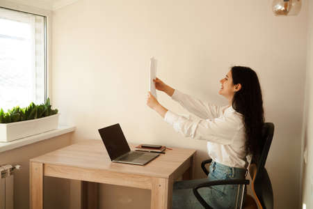 Student girl passed exam and rejoices at high mark. Online education and distance learning. Woman...