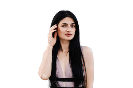 Tender woman with vitiligo pigmentation patches on hands on white background. Lifestyle with skin...