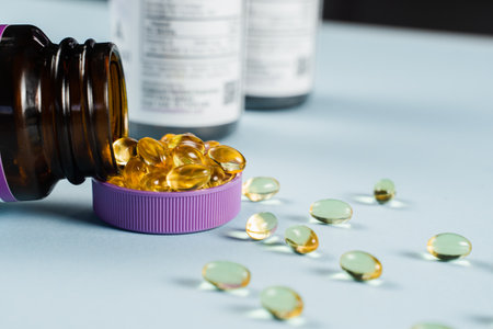 Collagen supplement capsules with plastic jar on the table. Collagen pills to support skin health. BADS biologically active dietary supplements for healthcareの写真素材