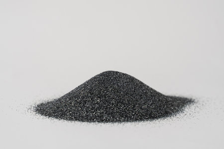 Silicon carbide abrasive powder for leveling stones isolated on white background. Silicon carbide for restore stones to original flatnessの写真素材