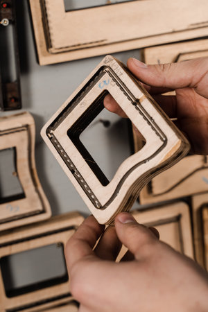 Forms for leather punching press for punch genuine leather. Craftsman tools. Process of creating genuine leather products in factoryの写真素材